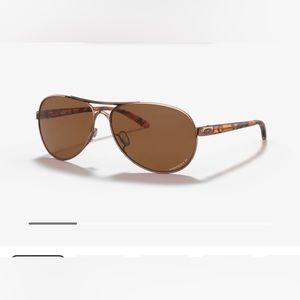Women’s rose gold Oakley sunglasses